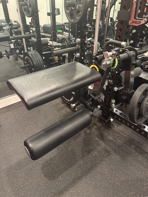 Bullet proof fitness Isolator with long lever arm and adjustable roller pad
